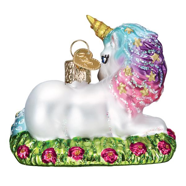 Baby unicorn glass ornament with a rainbow mane, gold horn, and a base of green grass and pink flowers