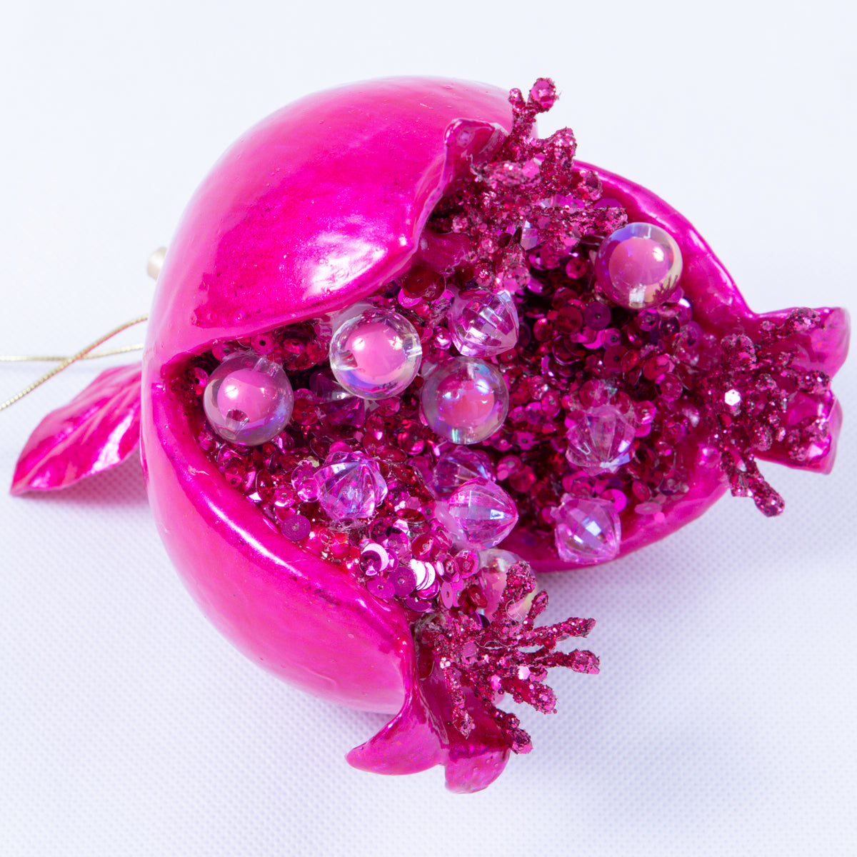 5-inch candy apple pink pomegranate ornament with glitter and bead interior on a white background.