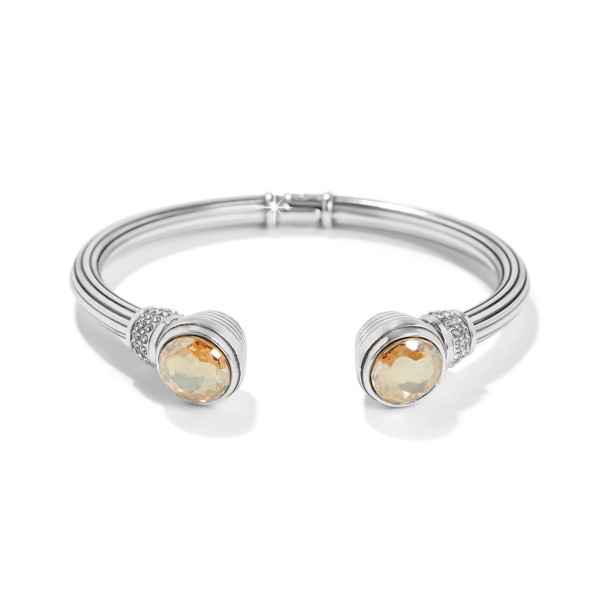 Silver-plated Meridian Aurora Petite Hinge Bangle with golden crystals and pavé accents.