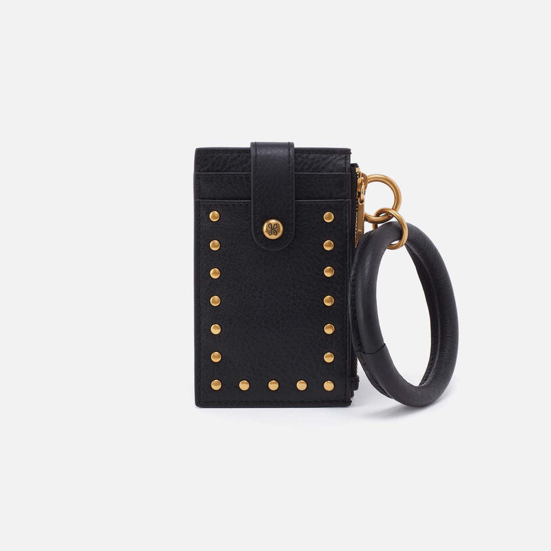 Black leather ring wristlet with gold studs, card slots, and a removable circular handle.