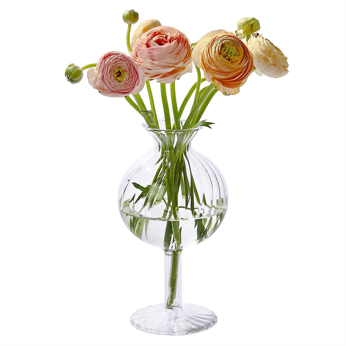 Verre Fluted Swirl Globe Vase with a round body and pedestal base holding pink ranunculus flowers.