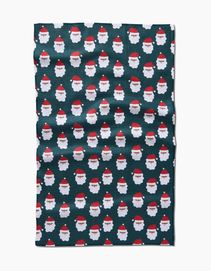 Holiday tea towel with waffle weave construction in festive red featuring a white snowflake pattern.