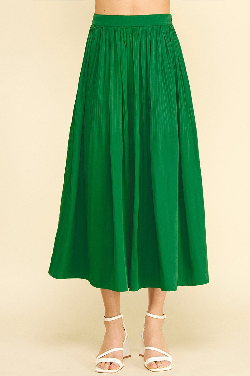 Maggy pleated A-line midi skirt in solid polyester with a flowing silhouette.