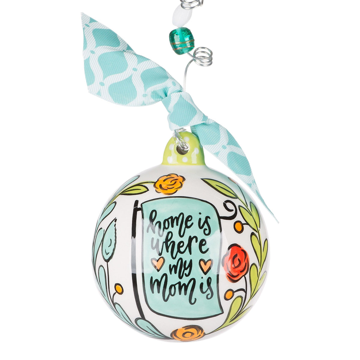 Hand-painted ceramic ornament with a tree branch motif in earthy tones.