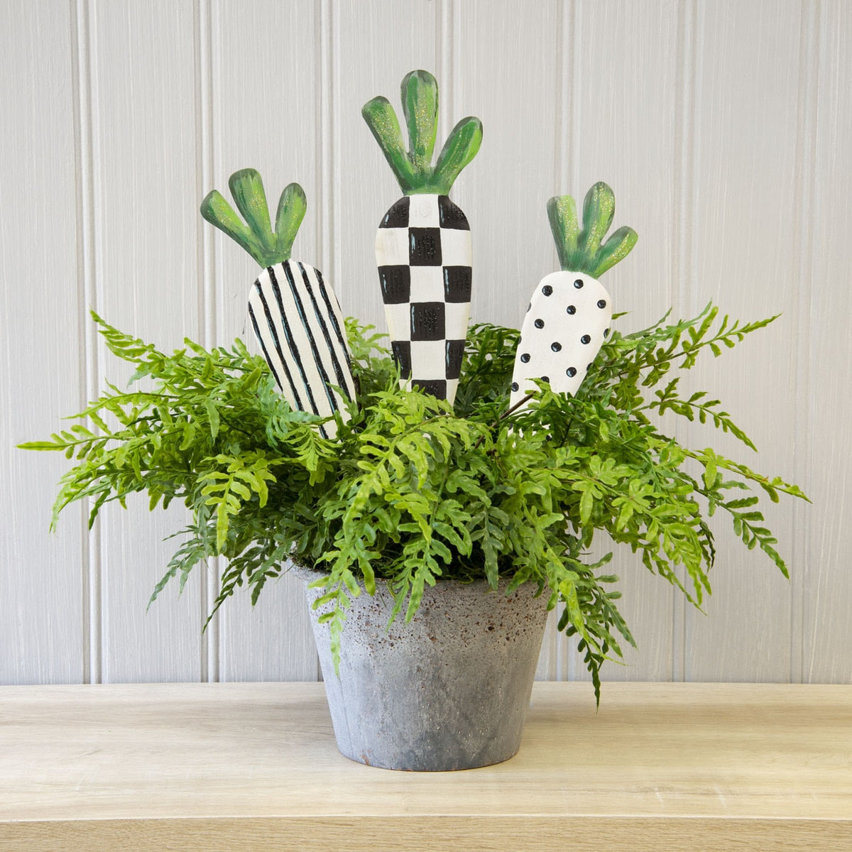 Stake/hang function decorative carrots in natural wood finish with visible grain texture.