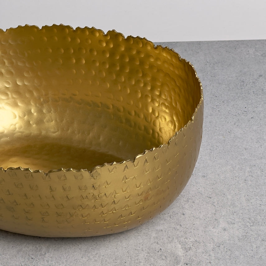 Oval hammered aluminum bowl with gold finish