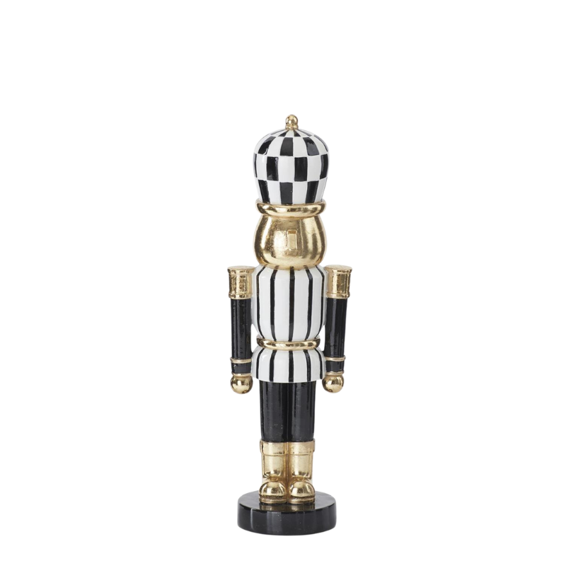 Black, white, and gold striped nutcracker with a checkered hat.