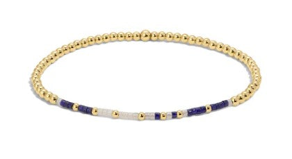 Joshua 1:9 gold-filled beaded bracelet with blue and white accents on an elastic cord.
