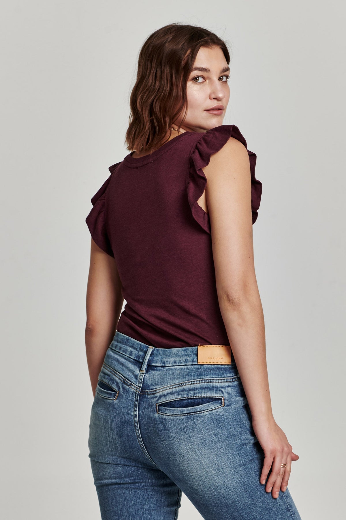 Alice North ruffle-trimmed top in light blue cotton-rayon blend with a relaxed silhouette.