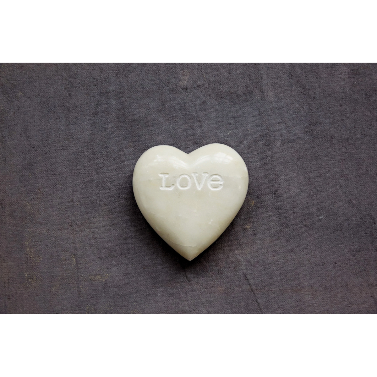 Soapstone heart sculpture with engraved word Love