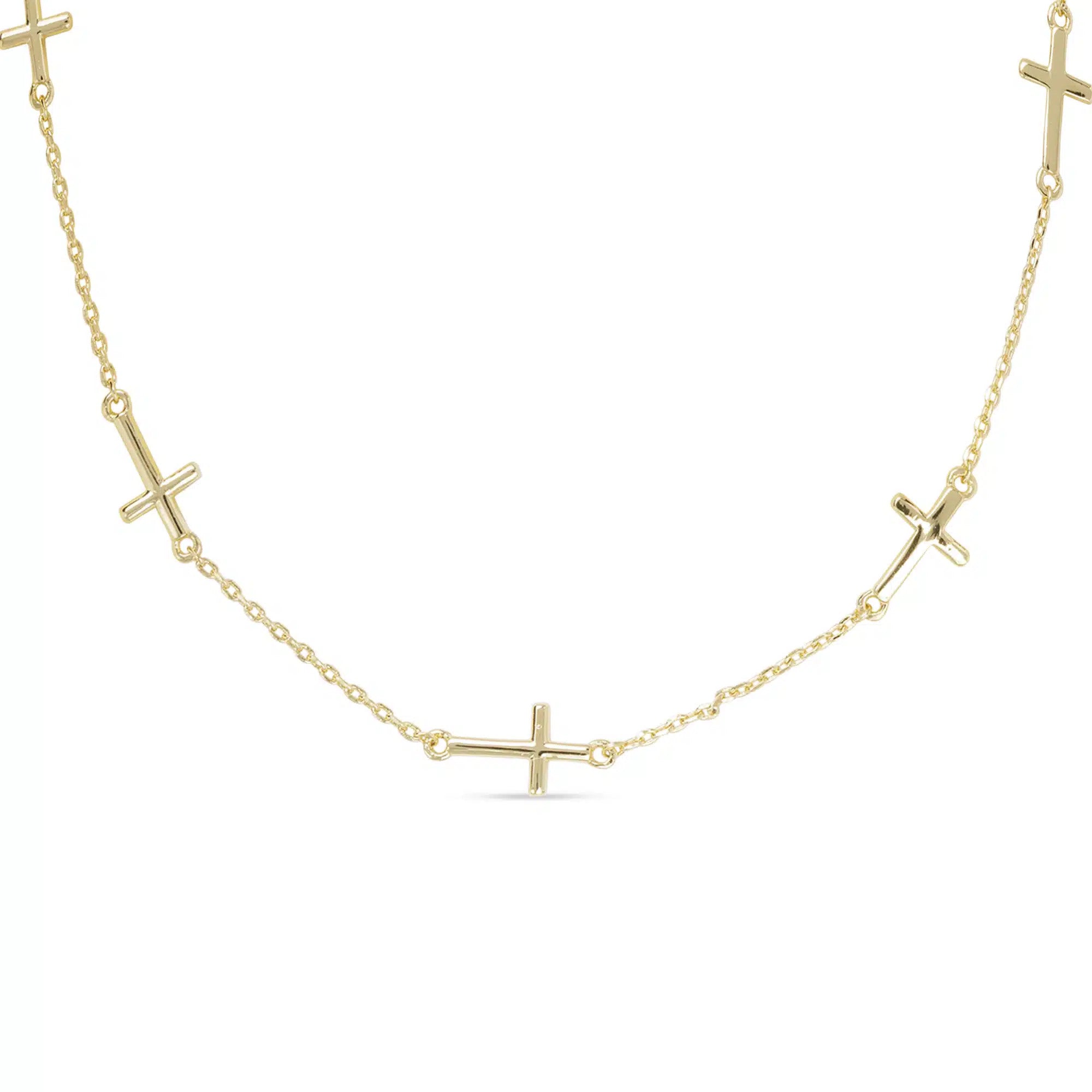 Gold station necklace with small polished cross charms spaced along a delicate chain.