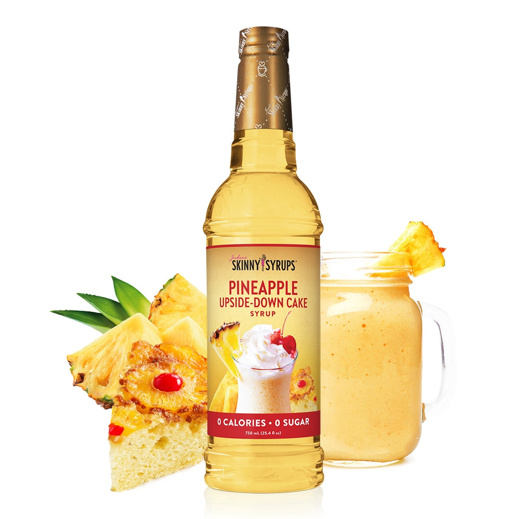 A clear glass bottle containing vanilla almond flavored sugar-free syrup with a white cap.