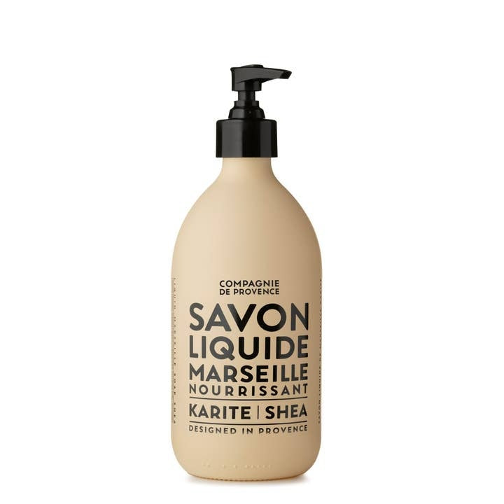 Compagnie de Provence Liquid Marseille Soap Shea Butter in a 16.7 fl oz beige glass pump bottle.