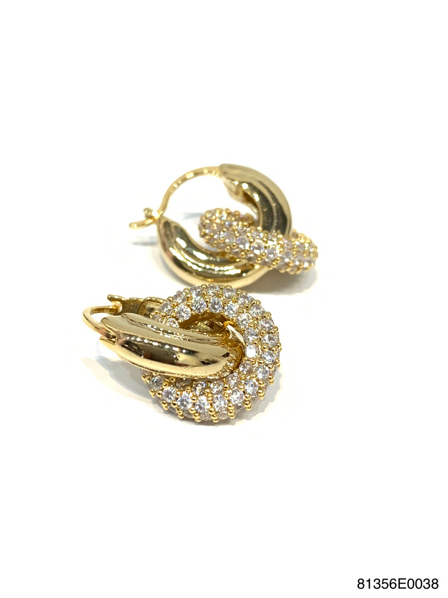 Gold CZ hoop earrings with a pierced post on an ear.