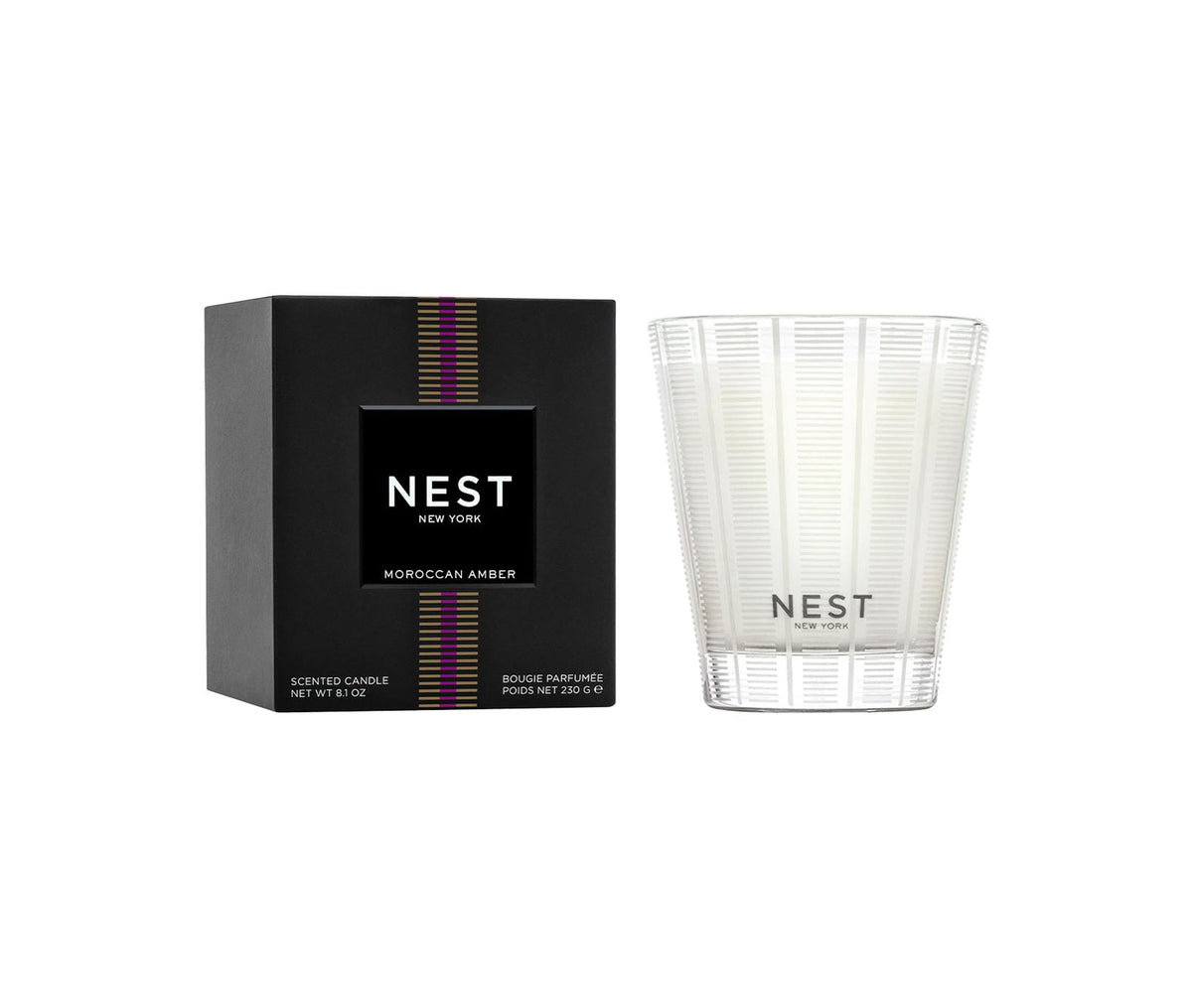 Nest Moroccan Amber Classic Candle in a clear frosted glass vessel next to its black box.