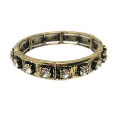 Metal stretch bracelet featuring clear round rhinestones in a segmented circular pattern.