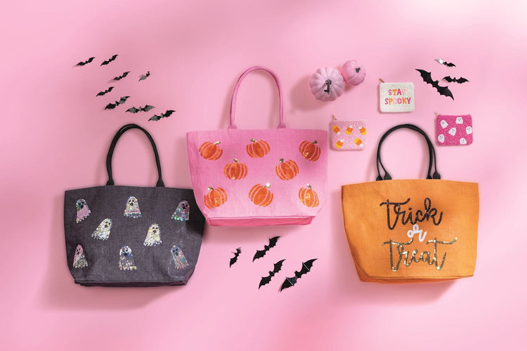 Three Halloween sparkle tote bags in black, pink, and orange with ghost, pumpkin, and text designs.