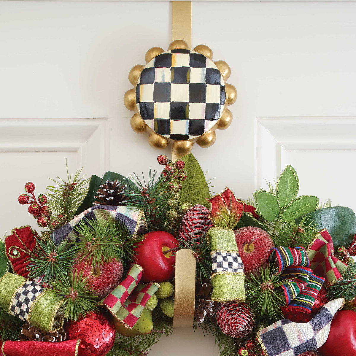 Polyresin courtly check wreath hanger with a black-and-white gingham pattern and curved silhouette.