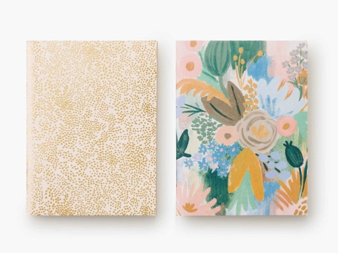 Pair of saddle-stitched pocket notebooks with uncoated natural vellum covers featuring metallic gold foil accents.