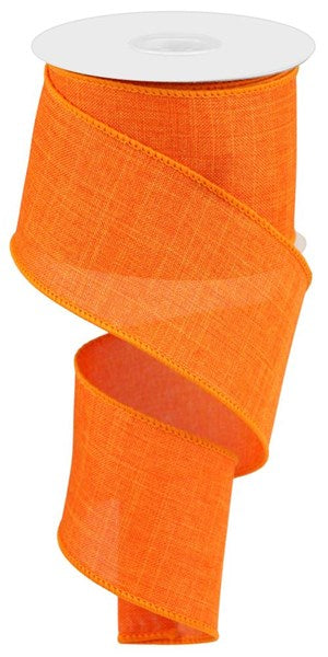Roll of royal blue polyester burlap ribbon measuring 2.5 inches wide.