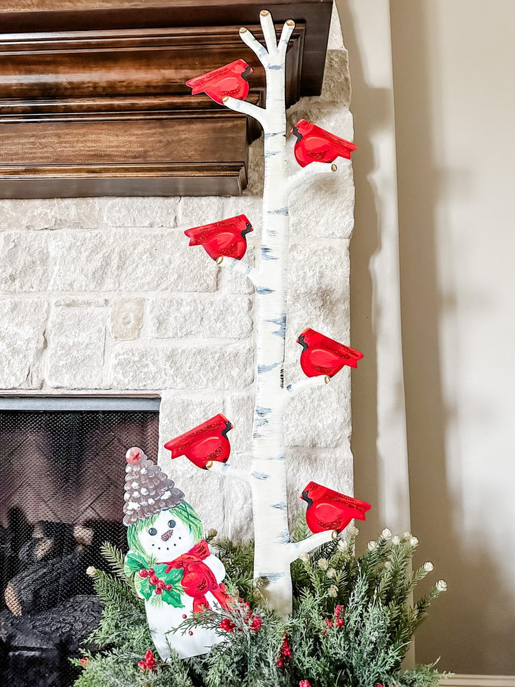 Cardinals on a Branch decorative stake featuring red birds perched on green foliage with brown branches.