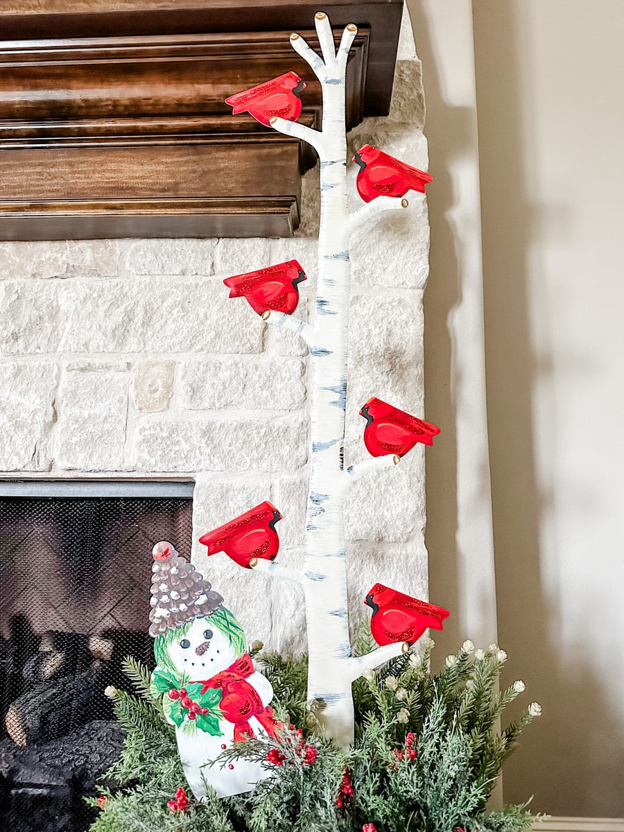 Cardinals on a Branch decorative stake featuring red birds perched on green foliage with brown branches.