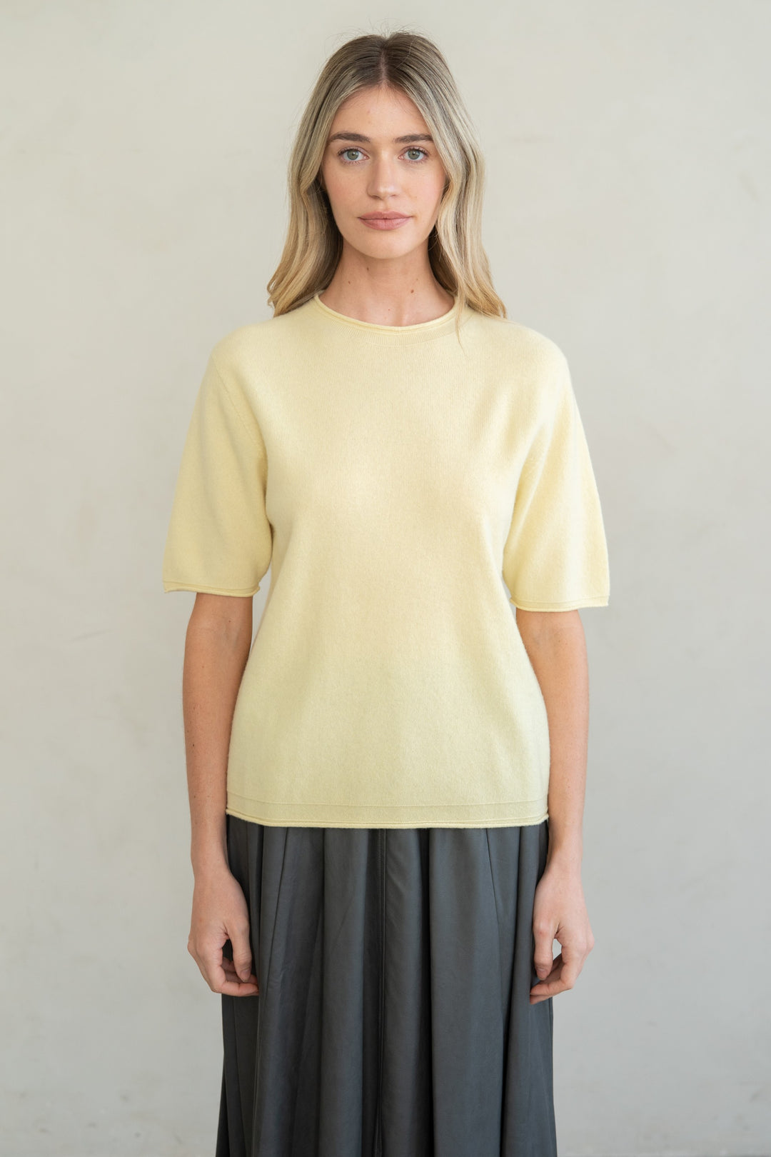 Emilia raw edge fine gauge crew knit top in soft neutral tone with relaxed silhouette and self-rolled sleeve edges