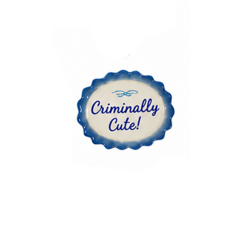 Hand-painted stoneware magnet shaped like a scalloped mini plate with "Criminally Cute!" in blue.