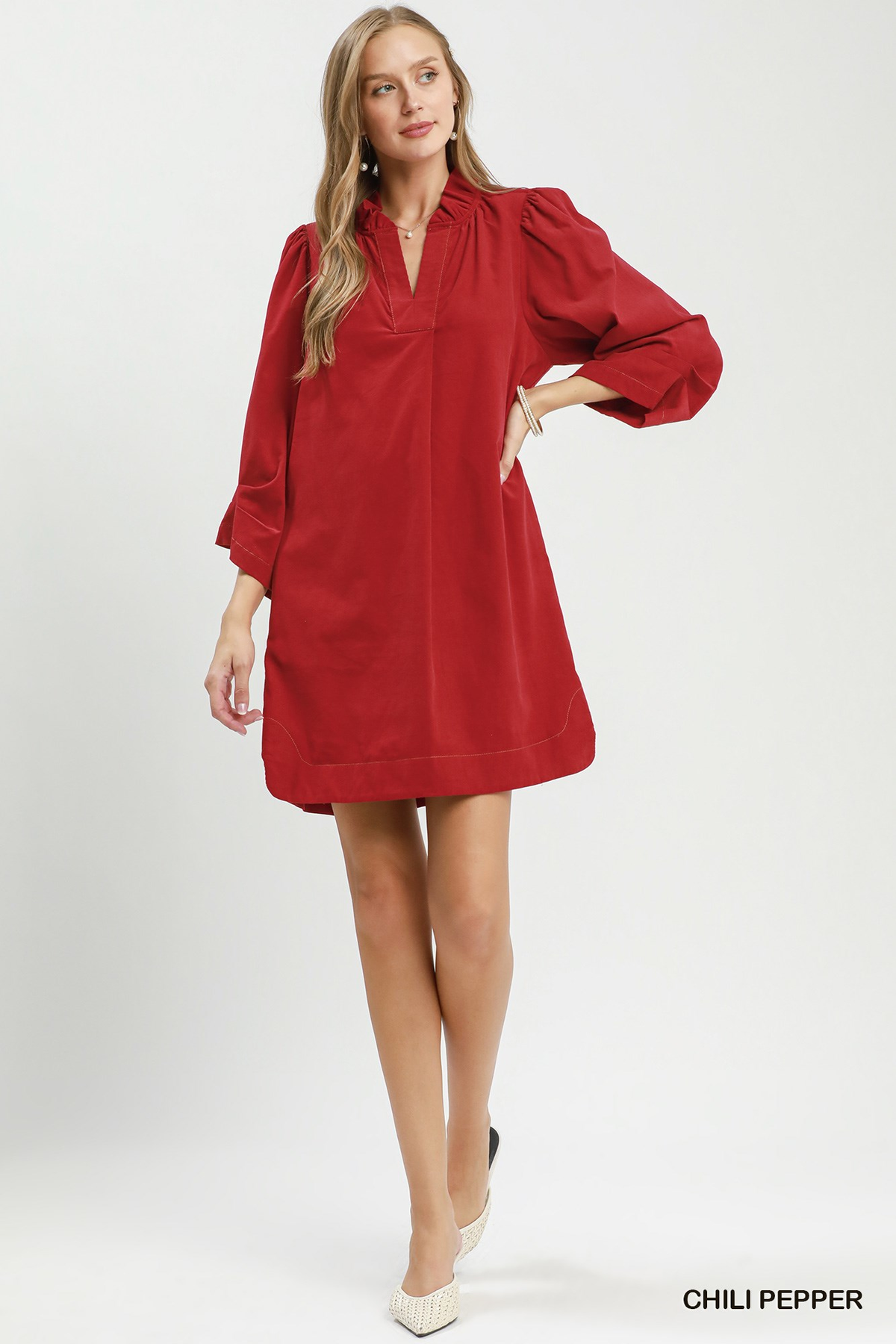 Woman wearing a red Olivia Corduroy Split Neck Puff Sleeve Shift Dress with white flats.