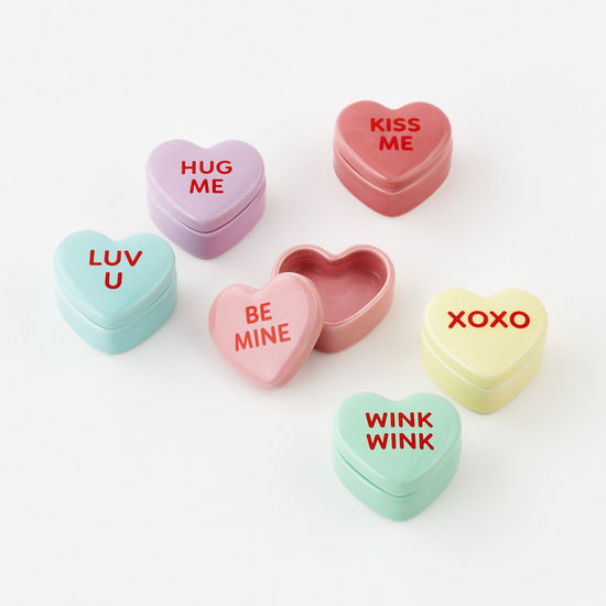 Porcelain conversation heart ring box with a red heart motif on white.