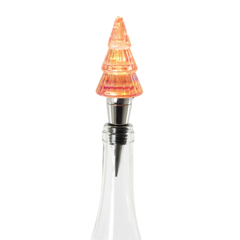 Lit tree-shaped bottle stopper with a glowing orange glass top and metal base in a glass bottle.