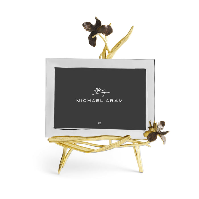 Black iris easel frame with oxidized brass accents holding a five by seven photo.