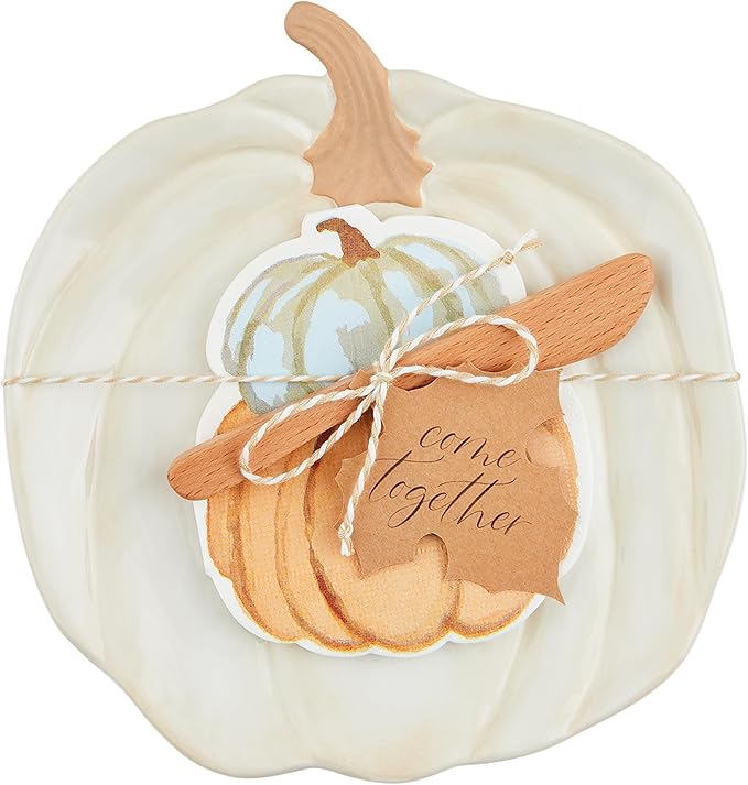 Pumpkin-themed cheese plate set with matching napkins featuring autumn leaf patterns.