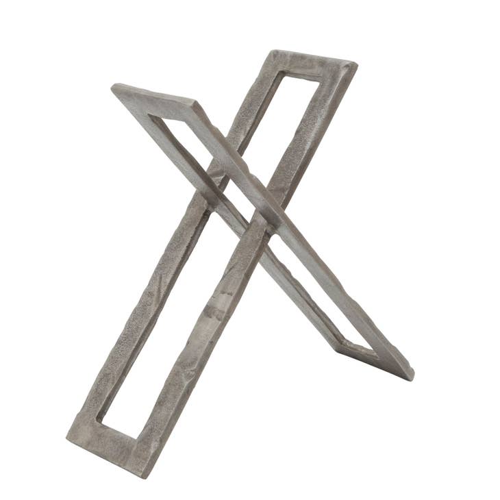 Twelve-inch gunmetal metal abstract sculpture with a geometric angular silhouette.