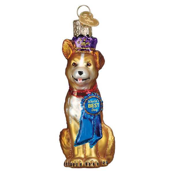 Red ceramic dog ornament with glossy finish hanging on a Christmas tree branch.