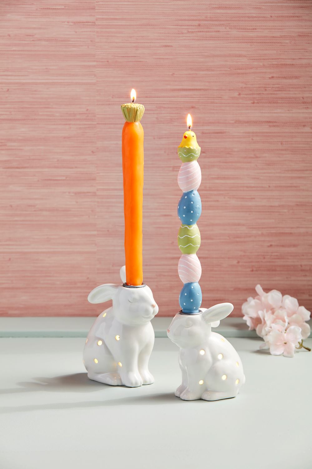 Hand-painted figural taper candle with a natural finish.