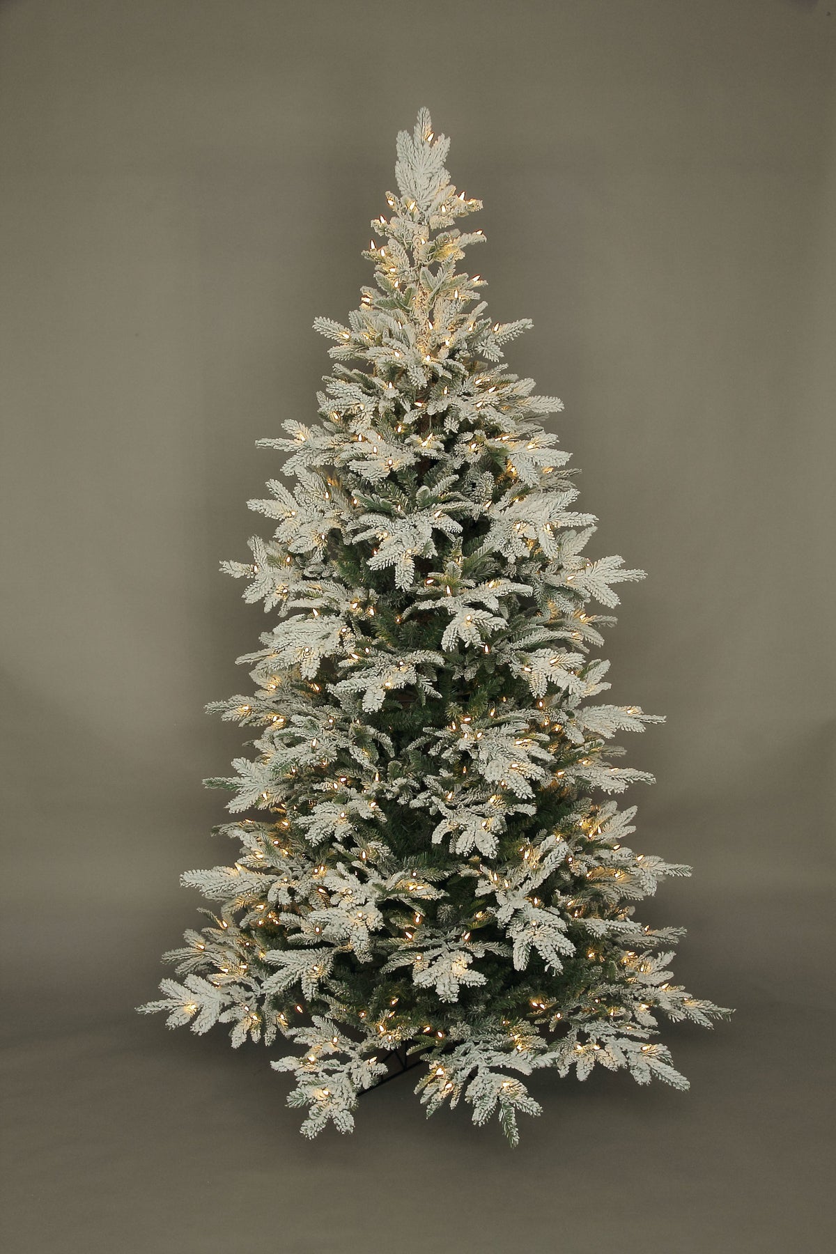 7.5-foot flocked Noble Fir artificial Christmas tree with warm LED lights