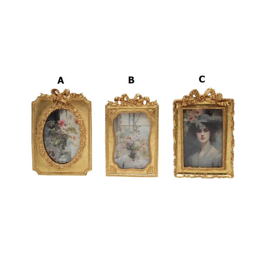 Gold-finish resin photo frame with a bow accent holding an 8x6 inch vertical rectangular shape.
