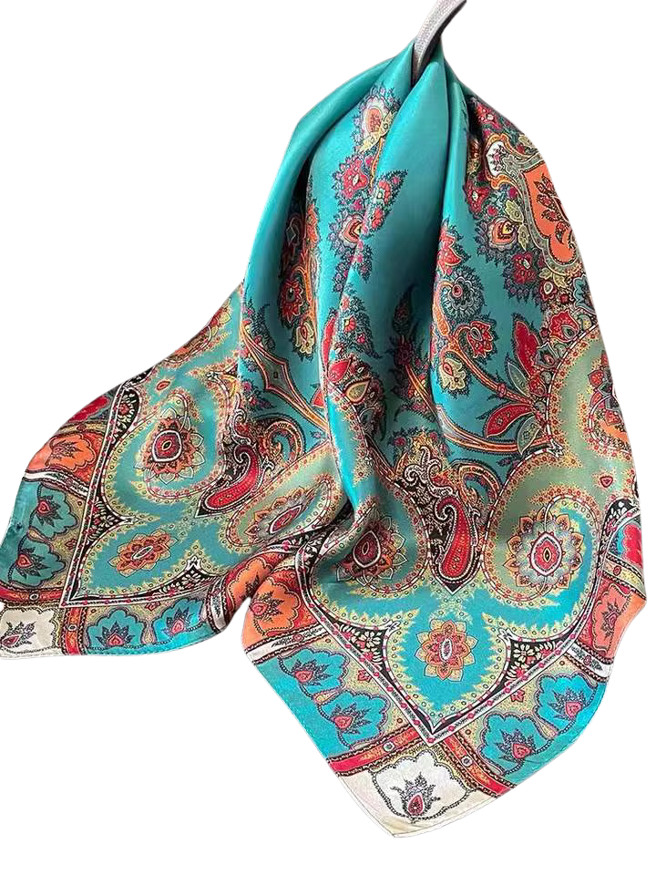 Teal silk square scarf with intricate red, orange, and gold paisley and floral patterns.