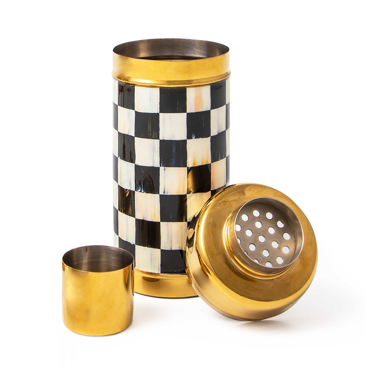 Courtly Check gold cocktail shaker with black and white checkered pattern and three separate pieces