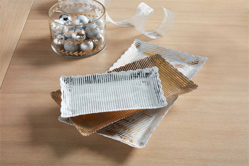 Small scalloped-edge metallic tray with a reflective silver finish.