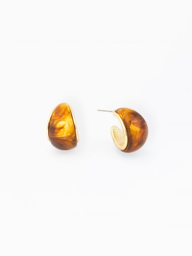 Veyda Earrings: Gold-plated brass and amber-colored resin hoop earrings with a marbled finish.