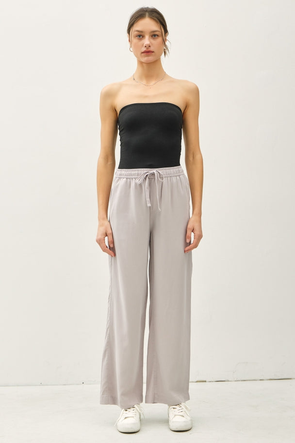 Women's Jane Tencel wide leg pant in neutral tone with elastic waistband and side pockets.