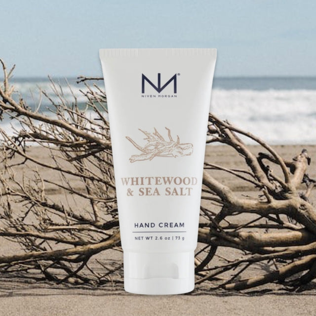 Whitewood & Sea Salt travel hand cream in a white tube with gold accents.