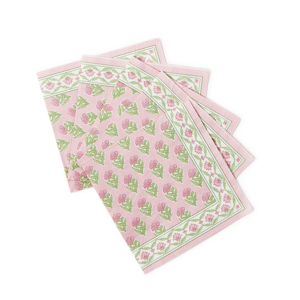 Stack of floral block print cocktail napkins in white paper with colorful botanical patterns.