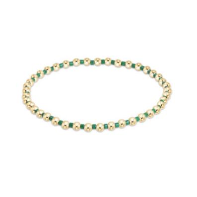 Hope Grateful bracelet featuring mixed 2mm seed beads in spring colors with gold-filled accents on elastic cord.