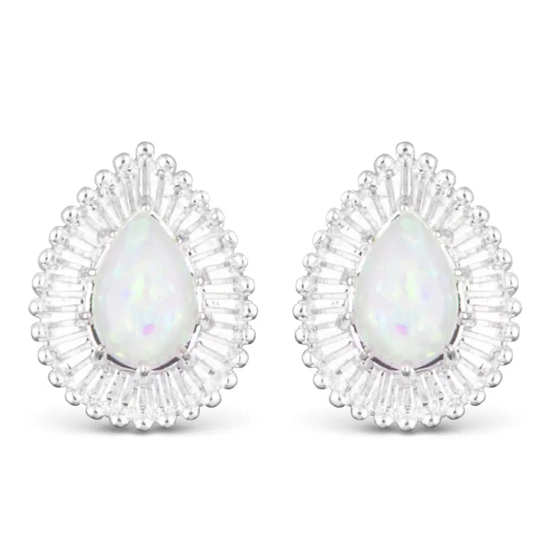 Teardrop-shaped opal stud earrings in a silver sunburst setting.