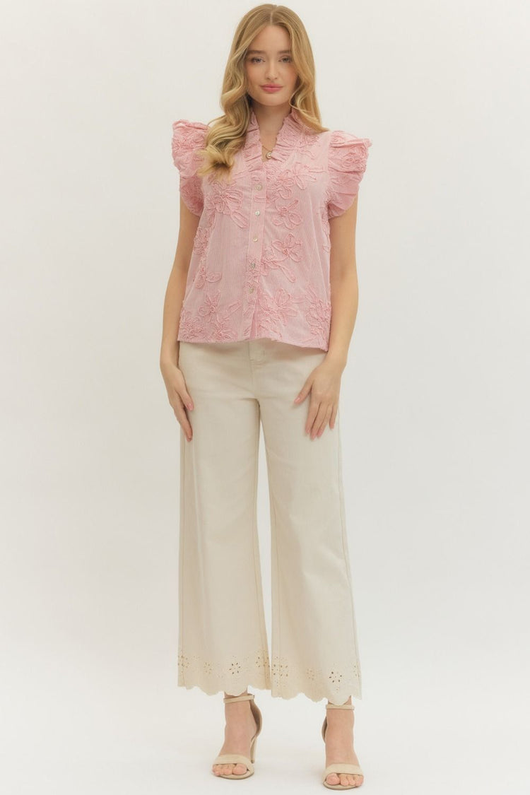Woman wearing a pink Leslie Striped Floral Applique Flutter Sleeve Top with beige wide-leg pants.