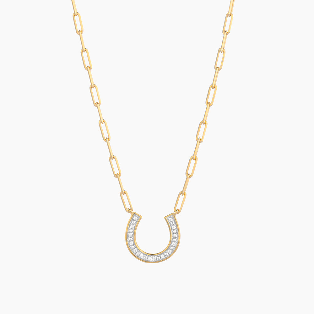 Gold-plated horseshoe pendant with sparkling diamonds on a paperclip link chain necklace.