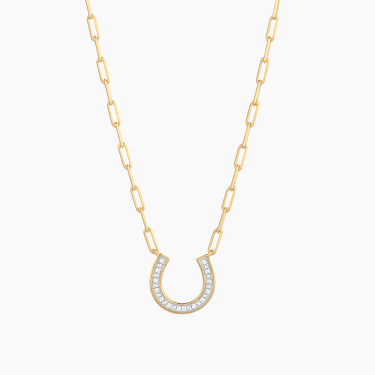 Gold-plated horseshoe pendant with sparkling diamonds on a paperclip link chain necklace.